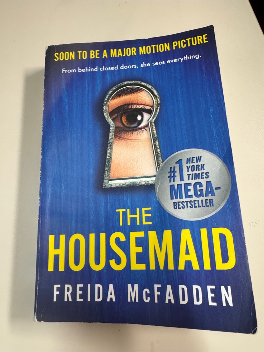 The Housemaid by Freida McFadden - Blue & Yellow Paperback